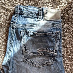 Blue Bootcut Jeans with Distressed Details